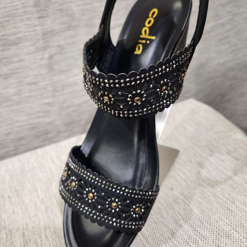 Detailed view of two stone embellished upper  mesh base straps with cut-out design