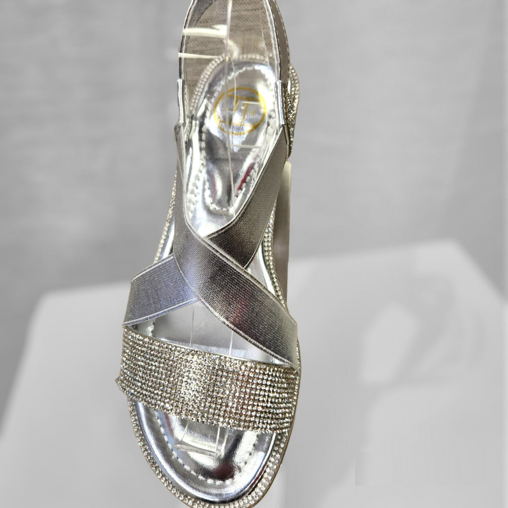 Front view of silver sandals with stones and sling back