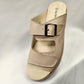 Front view of Beige slip on summer sandal with velcro closure