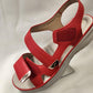 Velcro closure of red summer sandals