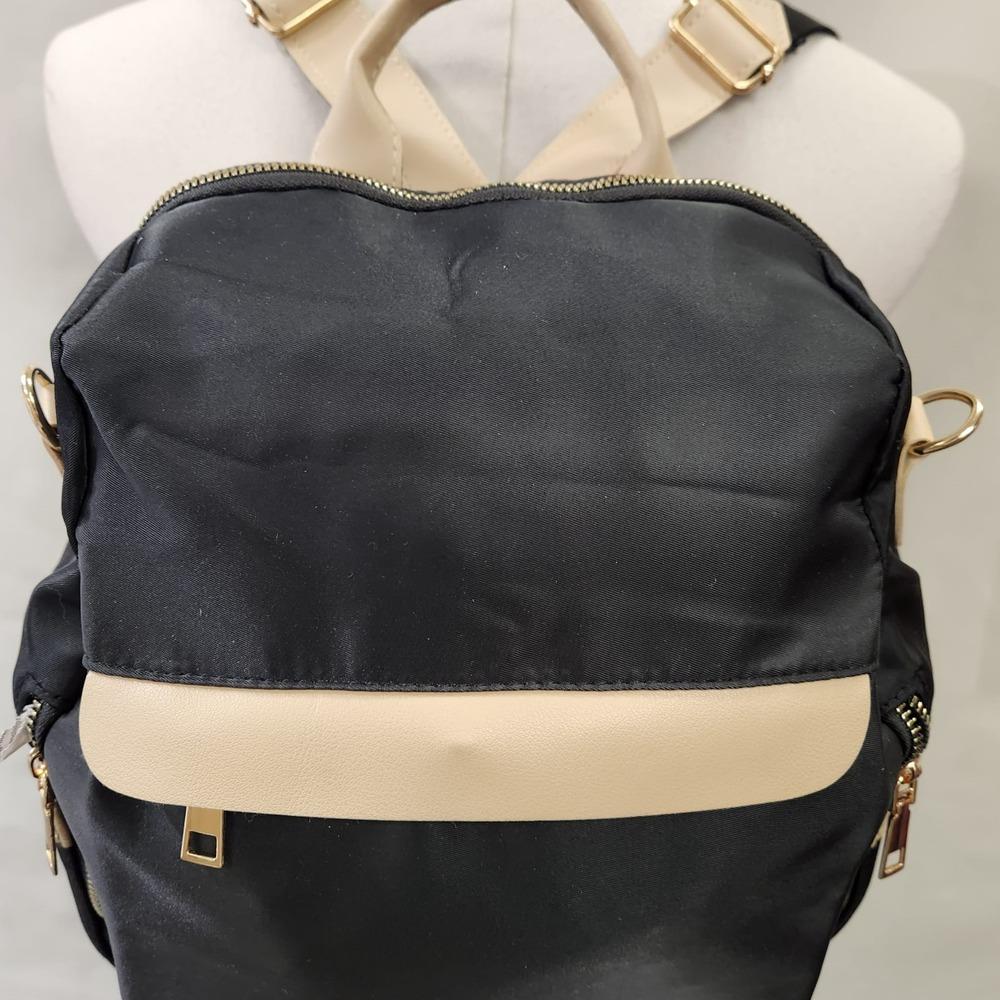 Multiple compartment black backpack with beige trim