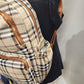 Side pockets on Multiple compartment plaid pattern backpack