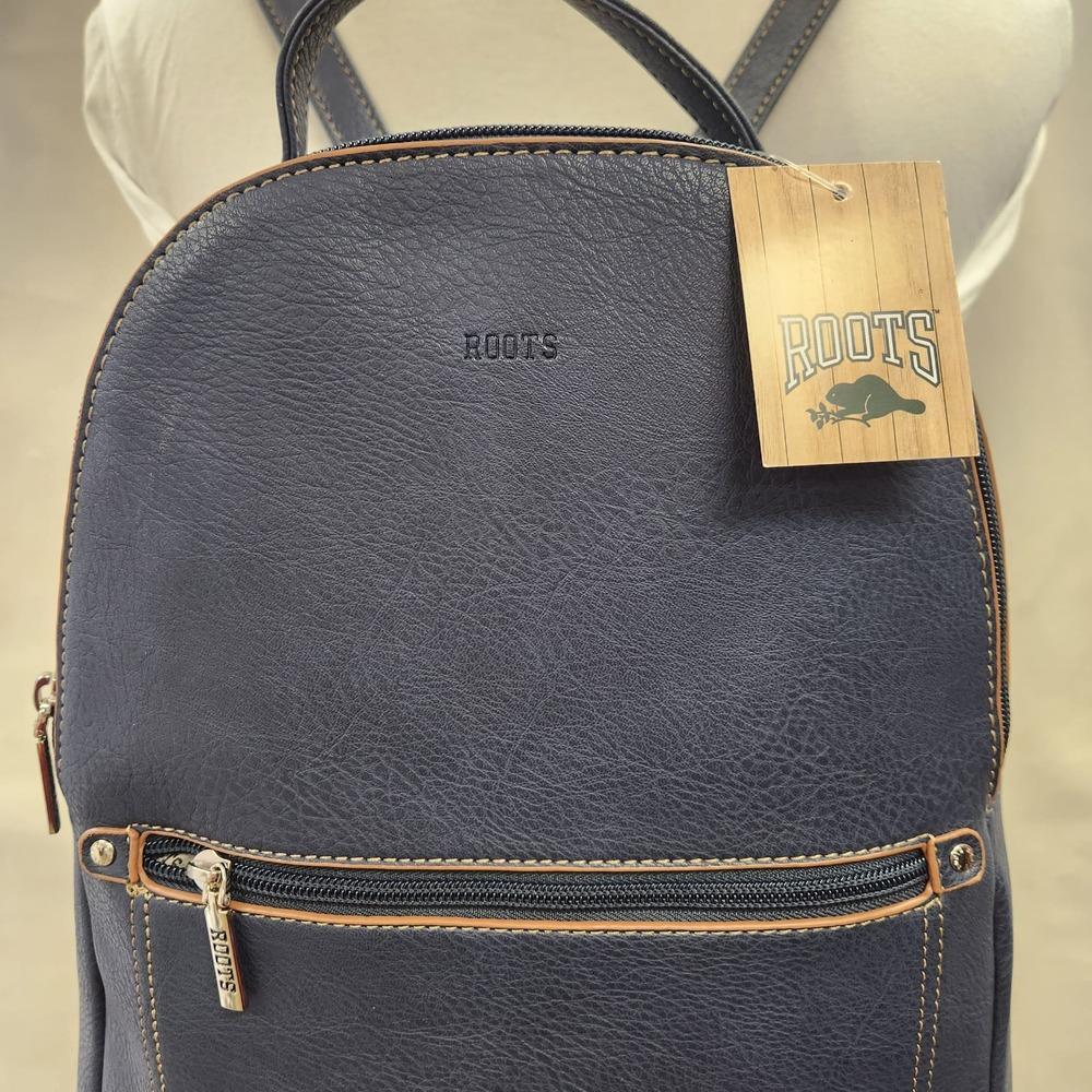 Closer view of the front of Roots backpack in blue with tan trim
