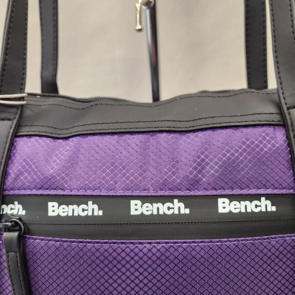 Detailed front view of Bench Lunch bag in purple and black color