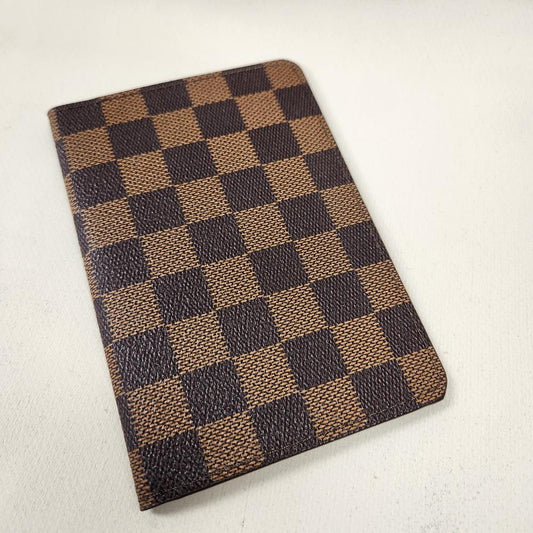 Checkered print passport cover in shades of brown