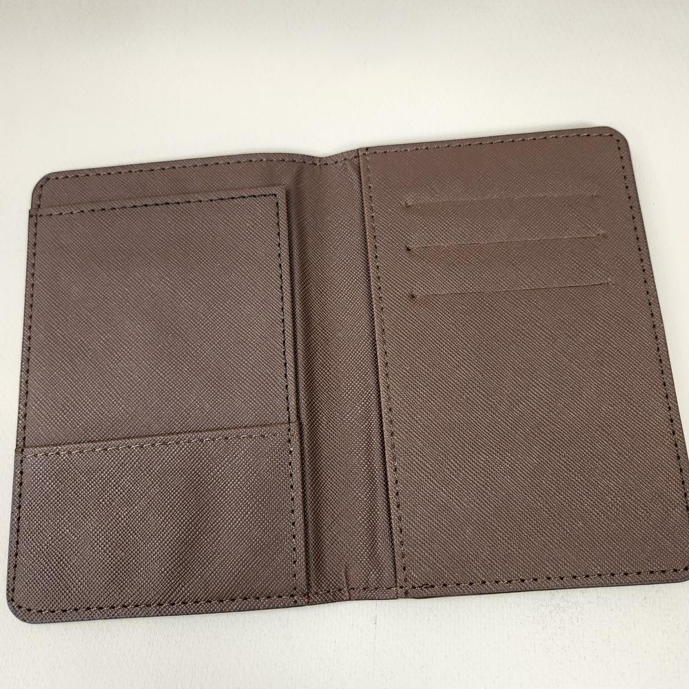 Checkered print passport cover in shades of brown when opened
