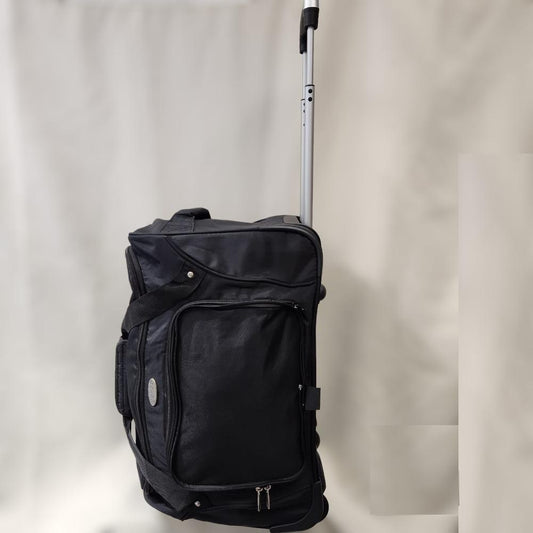 Full side view of black travel bag on wheels