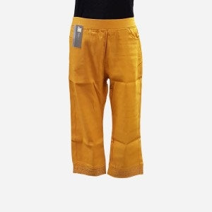Capri pants in mustard with stones along hemline