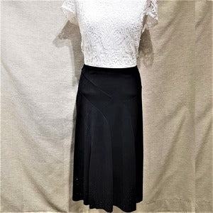 Full view of Black skirt with panels and stone embellishment