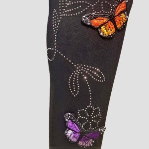 Detailed view of the butterfly applique and bead embellishment