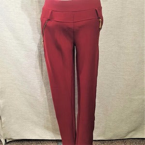 Full view of warm leggings in red with gold decorative zipper detail