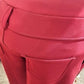 Belt loop detail of warm red leggings