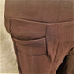 Front pocket details of warm leggings in brown