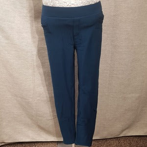 Front view of warm leggings in teal blue color