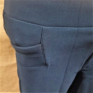 Front pocket detail of warm leggings in teal blue color