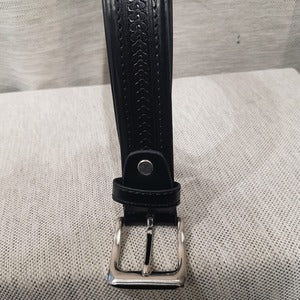Detailed view of Split leather belt for men with geometric pattern