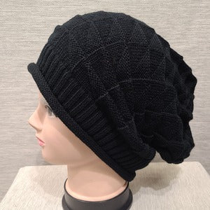 Side view of Knitted beanie cap in black 