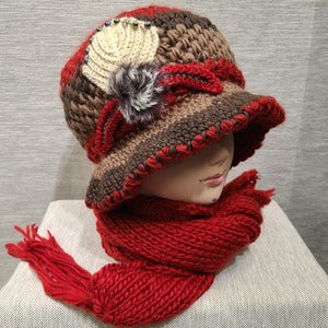 Alternate side view of Winter cap and scarf set in shades of red and brown