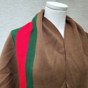 Detailed view of neckline for Brown colored cape with sleeves
