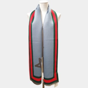 Light blue warm scarf with red and green border