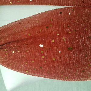 Detailed view of red crinkled scarf