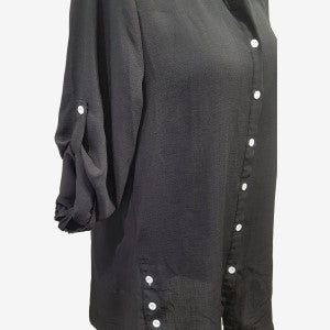 Side view of black pointed collar button down shirt with three-quarter roll-up sleeves