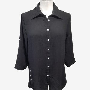Black pointed collar button down shirt with three-quarter roll-up sleeves