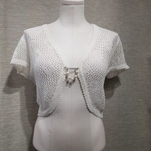 Full view of white crochet shrug with short sleeves