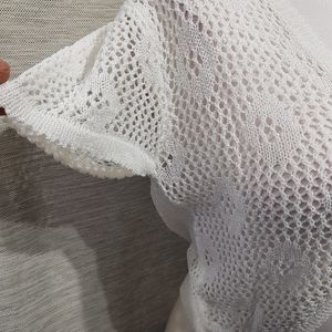 View of the sleeves for white crochet shrug 