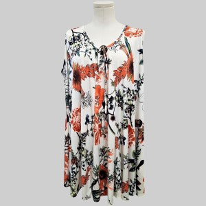 Flare cut sleeveless top in white with colorful print