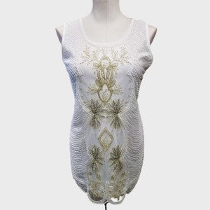 Full view of fancy white sleeveless sequin top with round neckline