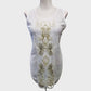 Full view of fancy white sleeveless sequin top with round neckline