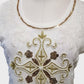 Detailed view of neckline of white sequin tunic top