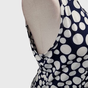 Close side view of black and white dotted dress