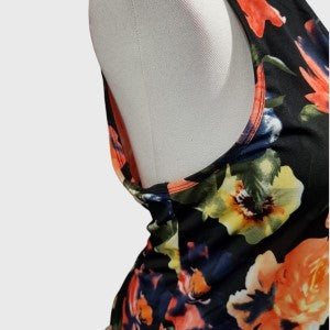 Close side view of dress in black with colorful floral print