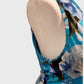Close side view of turquoise floral dress