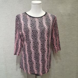 Full view of black and pink casual top in vibrant print