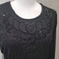 Neckline of black fancy sequins top with long sleeves