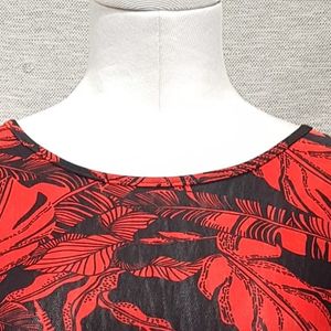 Neckline of black and red printed top