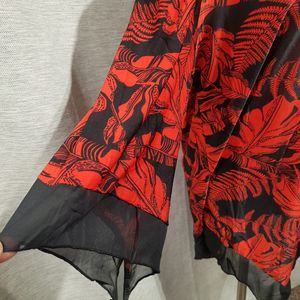Sleeves of printed black and red top 