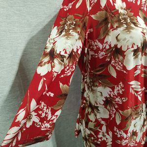 Side view of floral print top with gathering in front
