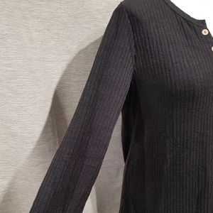 Side view of black top with notch neckline