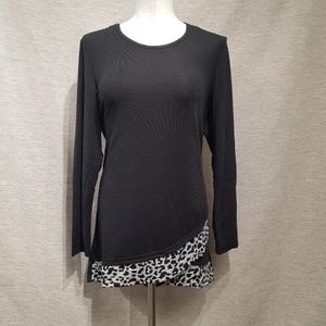 Full view of black top with fold over hemline