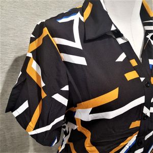 Side view of dress shirt in black with yellow and white print