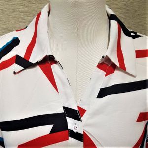 Collar view of dress shirt in white with black and red print