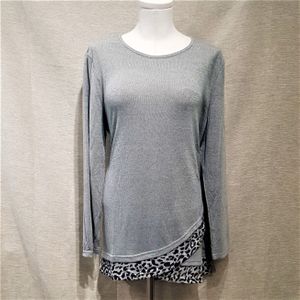 Full view of light grey top with fold over hemline