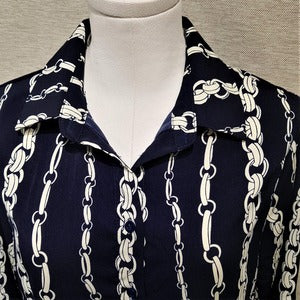 Neckline view of blue and cream printed shirt