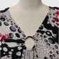 Neckline details of Printed top with cap sleeves