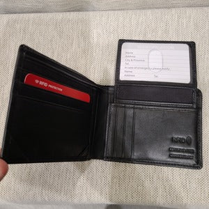 ID holder with thumb-slide feature