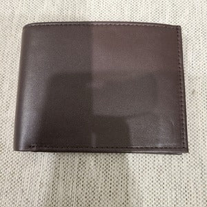 Closed view of flap wallet in brown for men